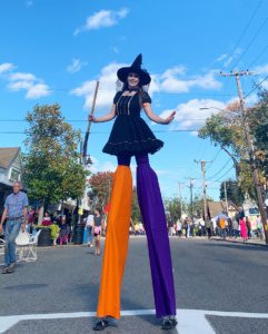 witch halloween harvest parade stilt walkers