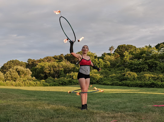 hula hoop performer fire performer