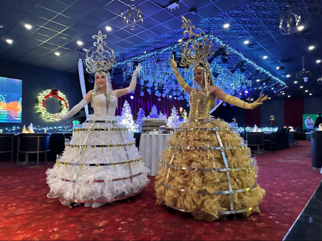 Strolling champagne skirt diva serving champagne at a high-end event in Boston, wearing an elegant costume and engaging guests with a unique interactive experience; ideal entertainment for weddings, corporate events, and luxury celebrations in cities like New York, Chicago, and Miami.